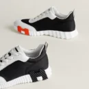 HERMÈS BOUNCING SNEAKER BLACK, WHITE & ORANGE